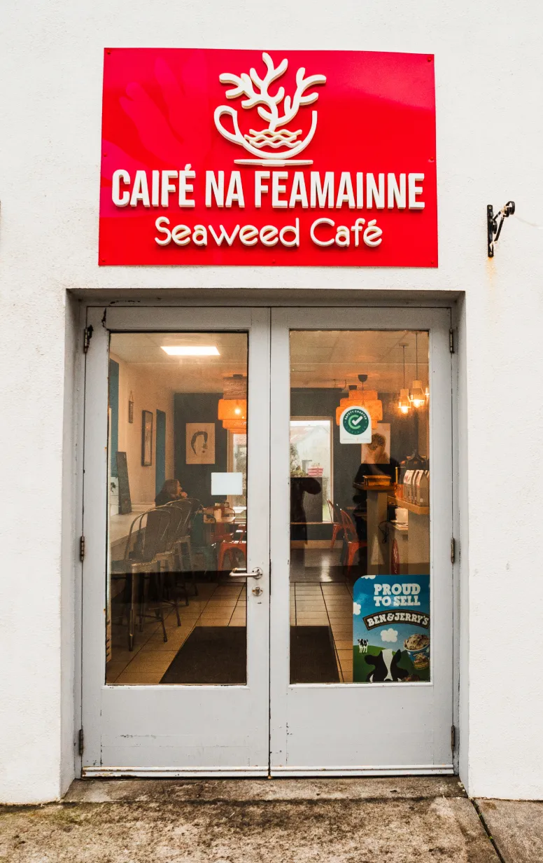 Entrance into Seaweed Cafe with sign above the door
